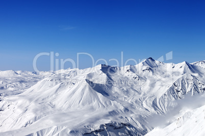 Snow mountains and blue clear sky