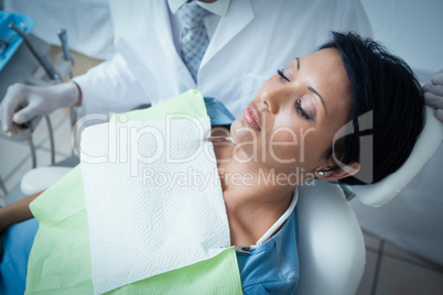 Close up of woman having her teeth examined