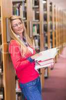 Mature student reading in library