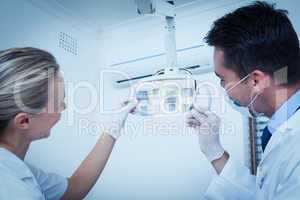 Dentists looking at x-ray