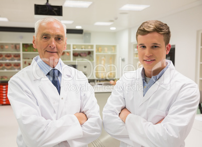 Science student and lecturer smiling at camera