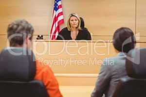 Judge and lawyer discussing the sentence for prisoner