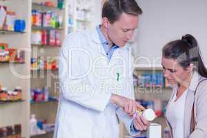 Pharmacist explaining the pills to patient