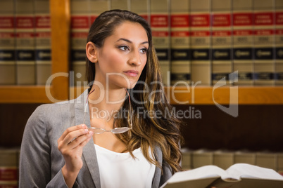 Pretty lawyer reading in the law library