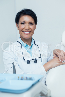 Portrait of smiling female dentist