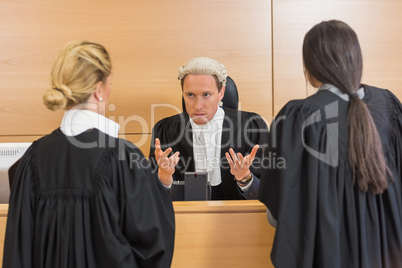 Lawyers speaking with the judge