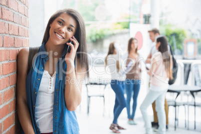 Pretty student talking on her phone