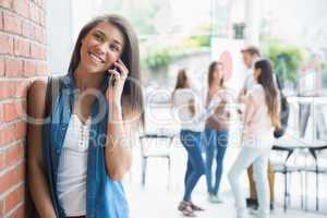 Pretty student talking on her phone