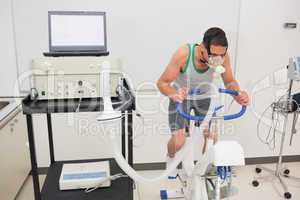 Man doing fitness test on exercise bike
