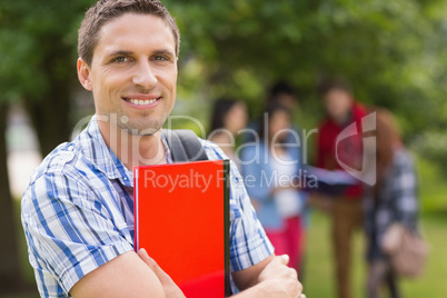 Happy student smiling at camera outside on campus