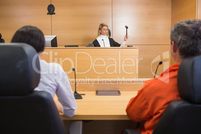 Lawyer and client listening to judge