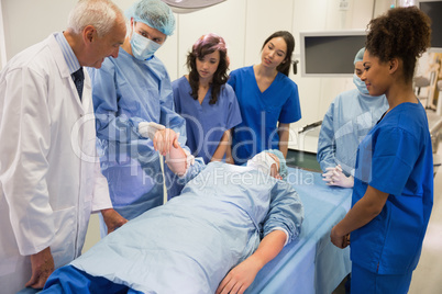 Medical students learning from professor