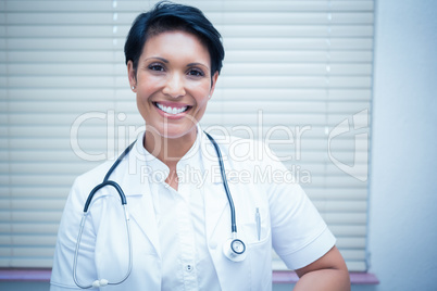 Confident smiling female dentist