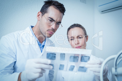 Dentists looking at x-ray