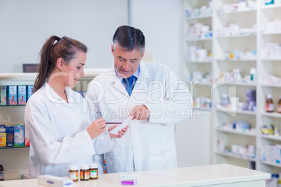 Pharmacist and his trainee working together