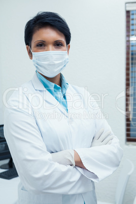 Female dentist wearing surgical mask