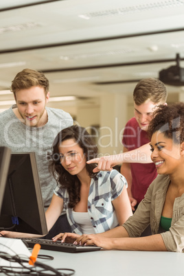 Classmates working together in the computer room