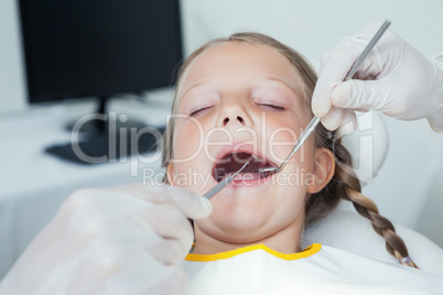 Close up of girl having her teeth examined