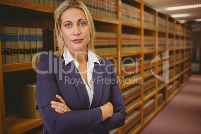 Serious woman standing with arms crossed