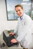 Focused pharmacist using his laptop