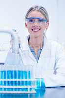 Science student using pipette in the lab