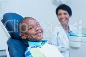 Smiling boy waiting for a dental exam