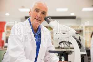 Medical professor working with microscope