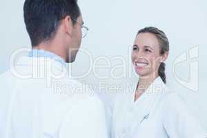 Smiling dentists in discussion