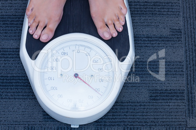 Close up of a woman standing on the scales