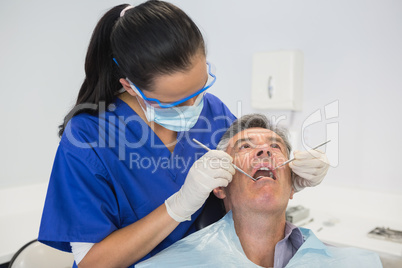 Dentist examining a patient