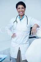 Portrait of smiling female dentist