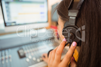 University student mixing audio in a studio