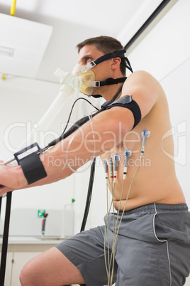 Man doing fitness test on exercise bike