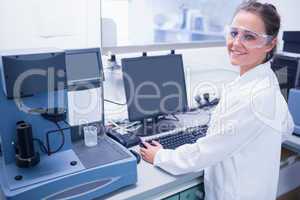 Portrait of a smiling young scientist with safety glasses