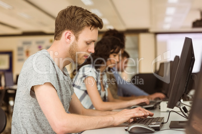 Classmates working in the computer room Classmates working in the computer room