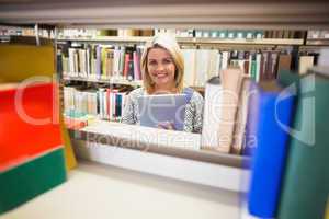Mature student smiling in library