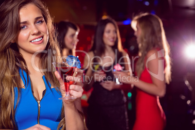 Pretty blonde drinking a cocktail