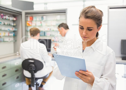 Junior pharmacist using tablet pc