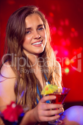 Pretty girl drinking a cocktail