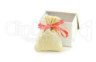 Bag with red ribbon .