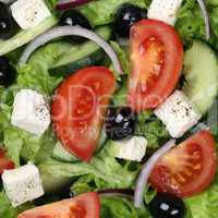 Hintergrund Griechischer Salat mit Tomaten, Feta und Oliven