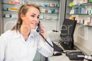 Young pharmacist on the phone