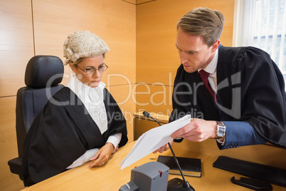 Lawyer speaking with the judge
