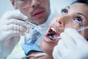 Close up of woman having her teeth examined