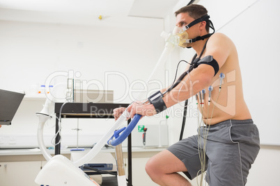 Man doing fitness test on exercise bike