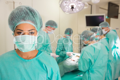 Medical students practicing surgery on model