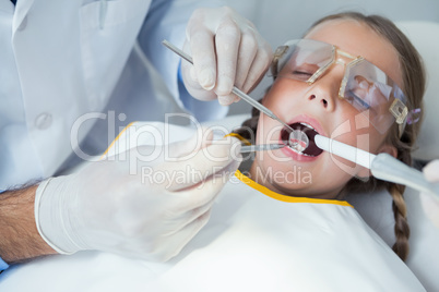 Close up of girl having her teeth examined