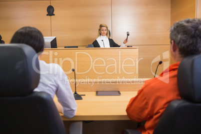 Lawyer and client listening to judge