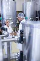 Biologist team talking and wearing hairnet