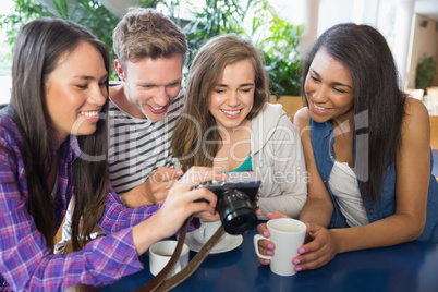 Young students looking at a camera